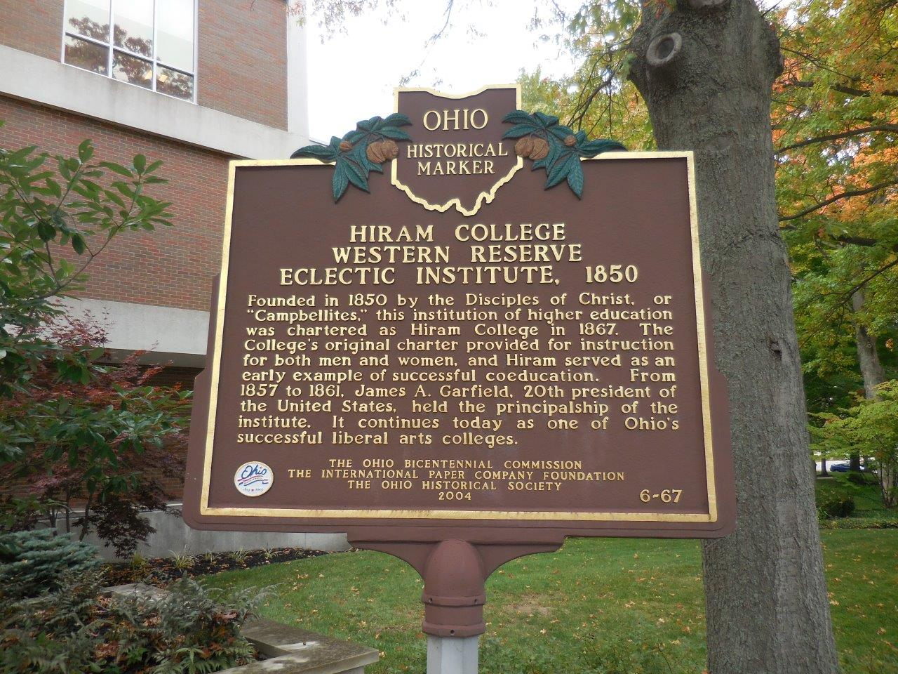 Iron sign of Ohio Historical Marker that reads "Hiram College Western Reserve Eclectic Institute"" and below a paragraph telling the story of the college, located near homes for sale in Hiram Ohio