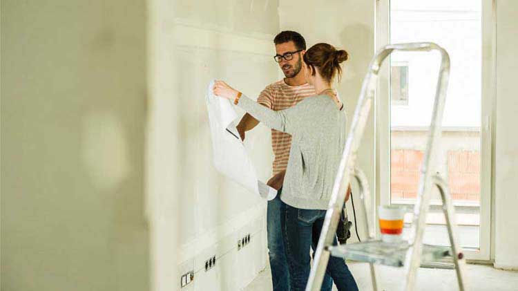 "Image showing various home updates in a Miami residence, including a hurricane-proof roof, impact-resistant windows, and an advanced home security system, depicting the enhancements that lower insurance costs."