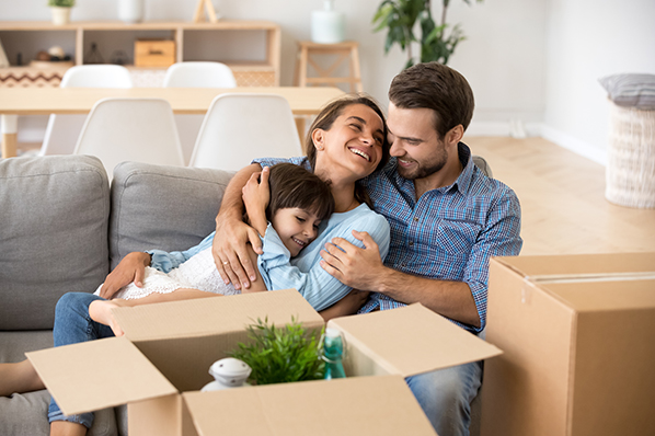 "A well-prepared family saving money while moving into their new home in Miami, carefully packing their belongings and planning ahead to ensure a cost-effective and smooth moving process."