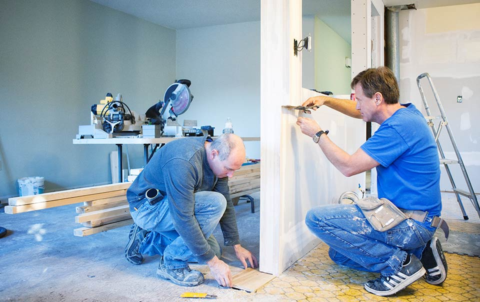 "Professional Miami contractor inspecting a home for potential repairs, representing the importance of finding a trusted professional for your home improvement needs in Miami."