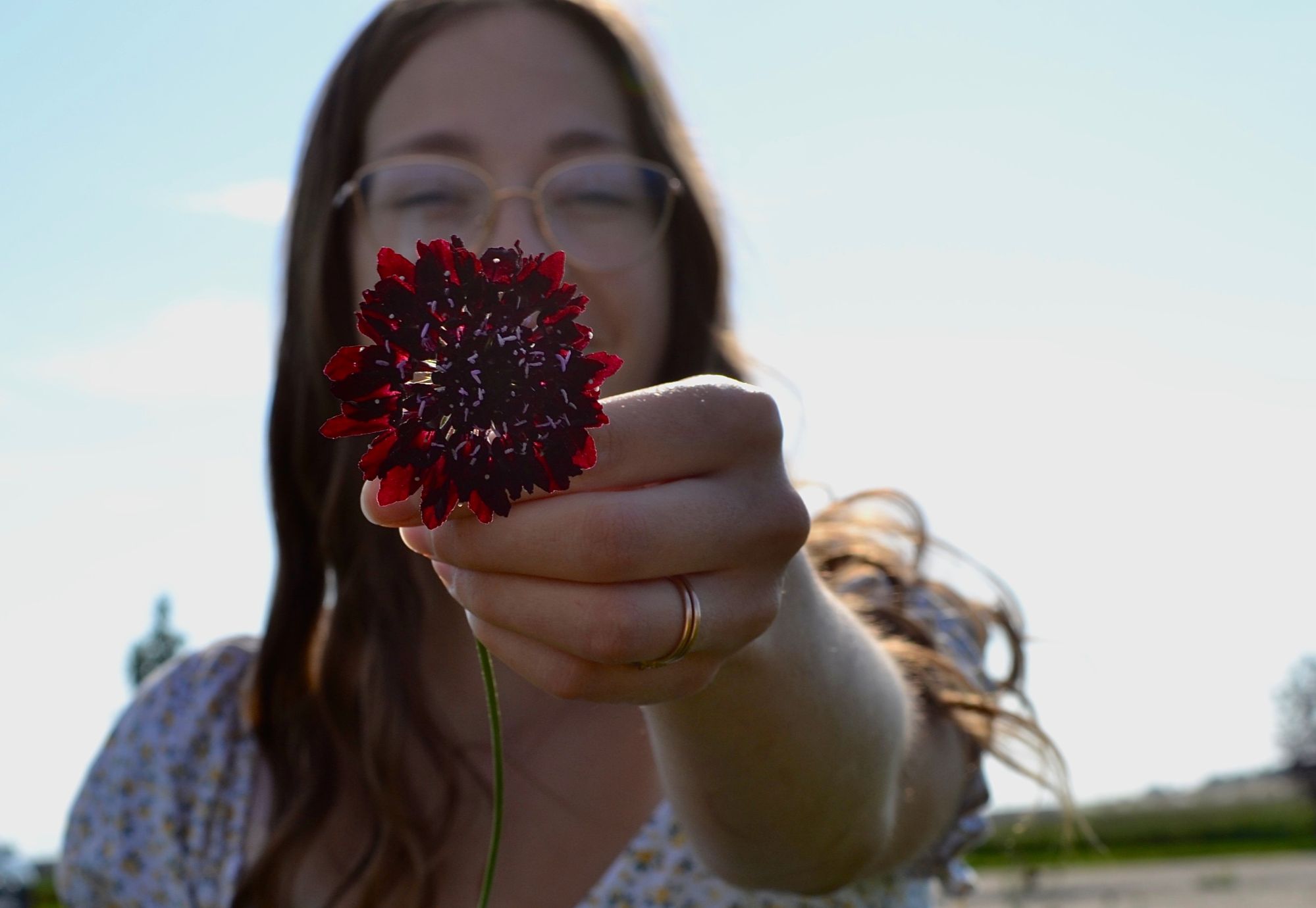 at lovely hollow farms holding flower