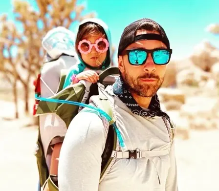 Anthony Gibson hiking with his daughter