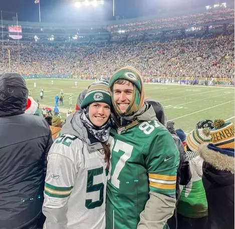 Brittany Wenninger and her husband Clay Wenninger, sharing the excitement and spirit of a memorable day at a Green Bay Packers game.