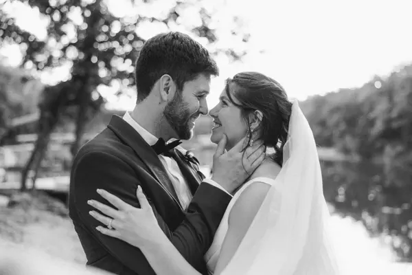 Brittany Wenninger and her amazing husband Clay Wenninger, sharing a magical moment on their wedding day, surrounded by love and happiness.