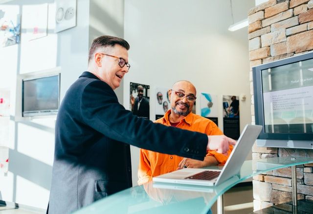 A home-buyer with his real estate agent