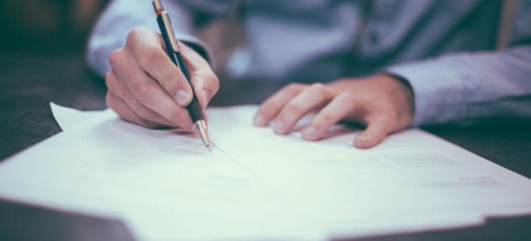 A person signing a contract