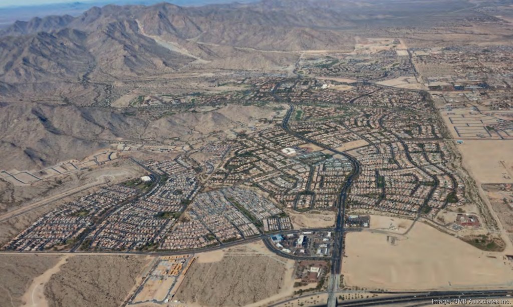 Aerial view of Verrado in Buckeye, AZ, showcasing its master-planned community layout, residential areas, and surrounding mountainous landscape, highlighting the scenic desert environment and well-planned infrastructure of this growing community.