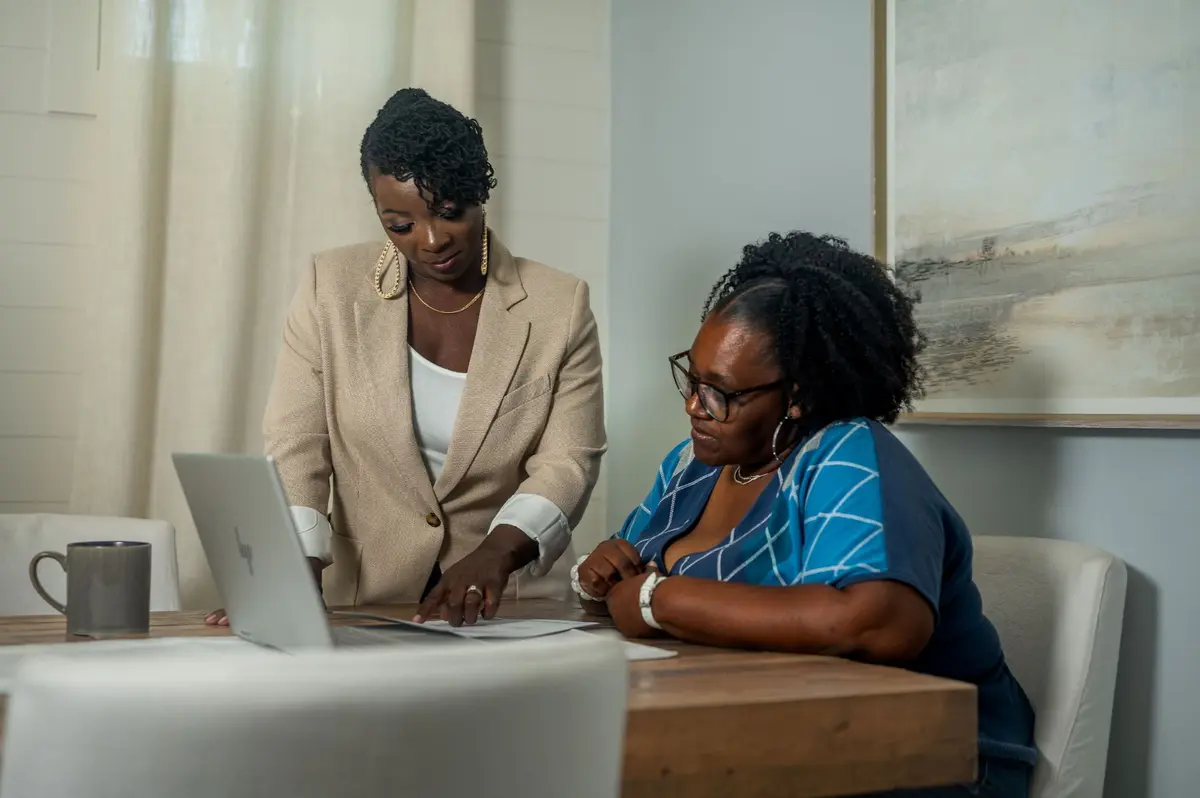 Alicia Brown discussing with a client.