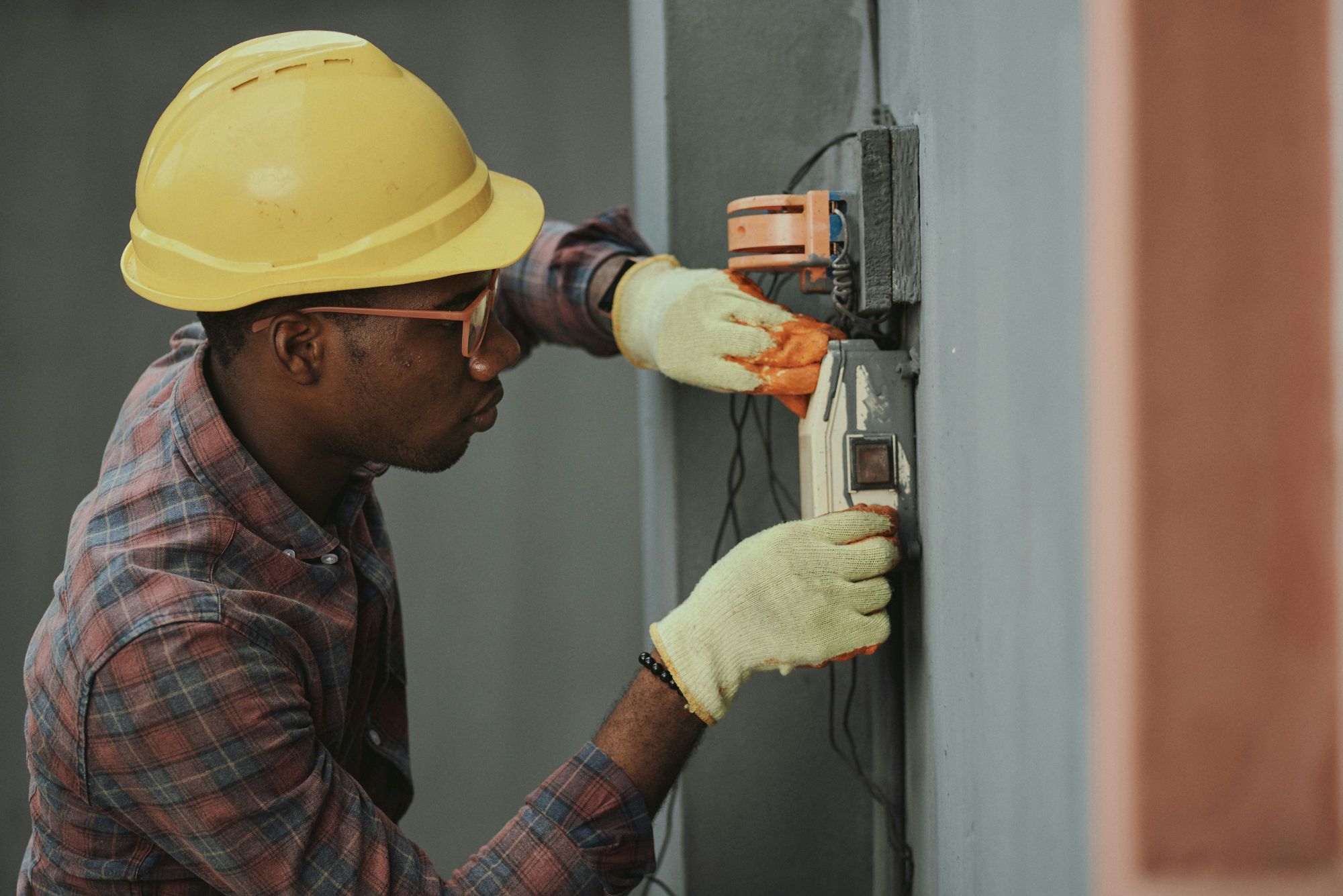 Electrician working on a home’s wiring.