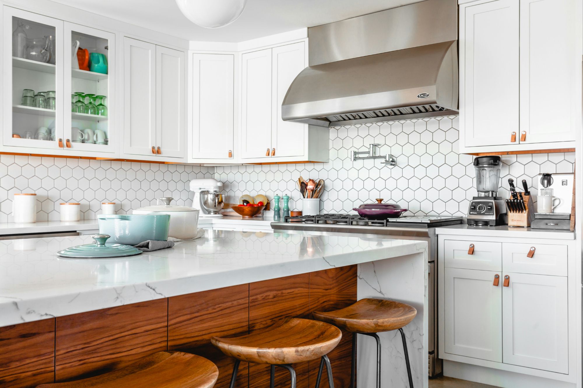 A kitchen with a gas stove and heating system