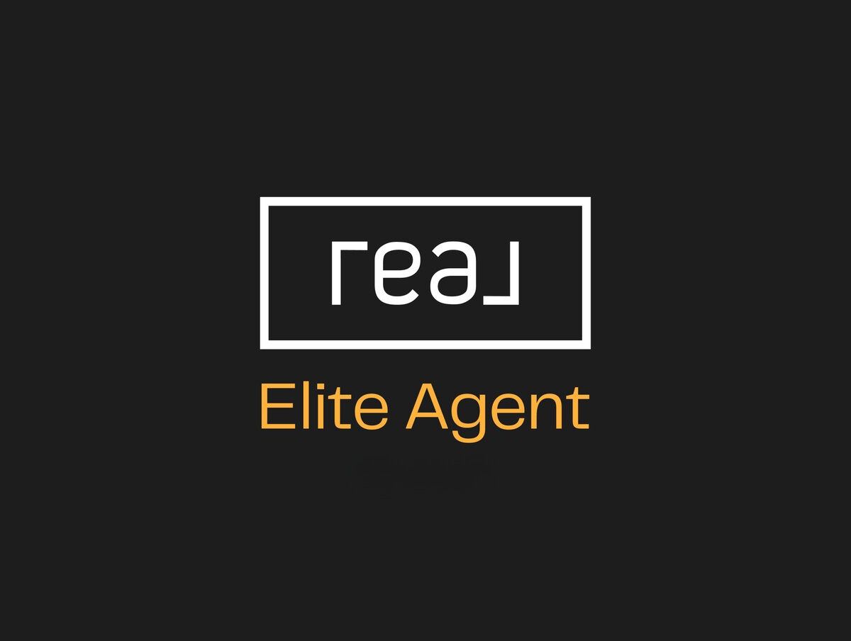 Real Broker Elite Agent production award logo, recognizing top-performing agents within the company. The Elite Agent designation is awarded to agents who demonstrate exceptional sales production and success. This prestigious title represents Real Broker’s commitment to excellence and rewarding its high-achieving agents with exclusive benefits and recognition.