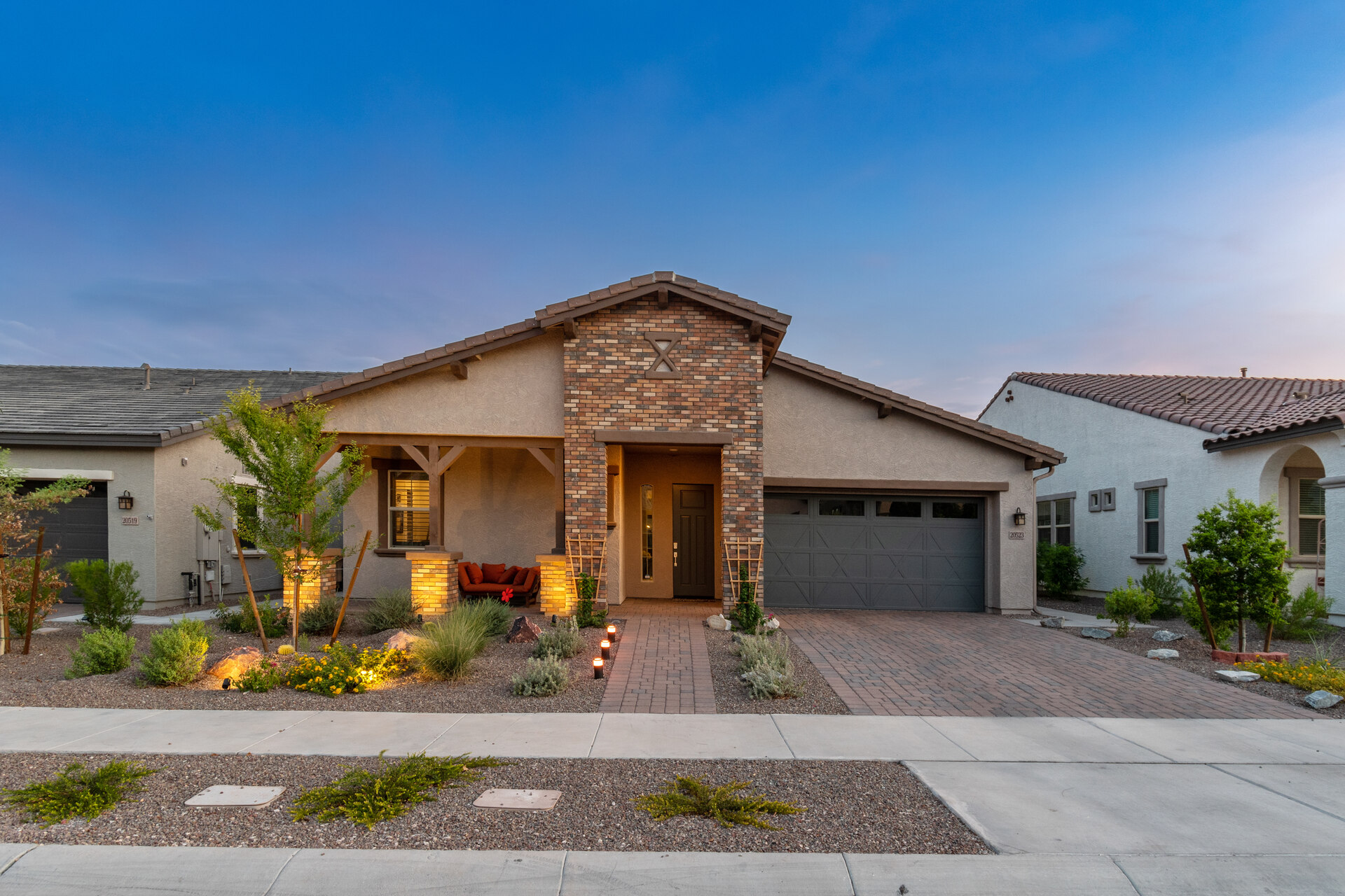 Affordable single-family home in Arizona with modern architecture, desert landscaping, and a welcoming front porch, illustrating attractive housing options for homeowners and investors looking to buy or rent in Arizona’s affordable real estate market.