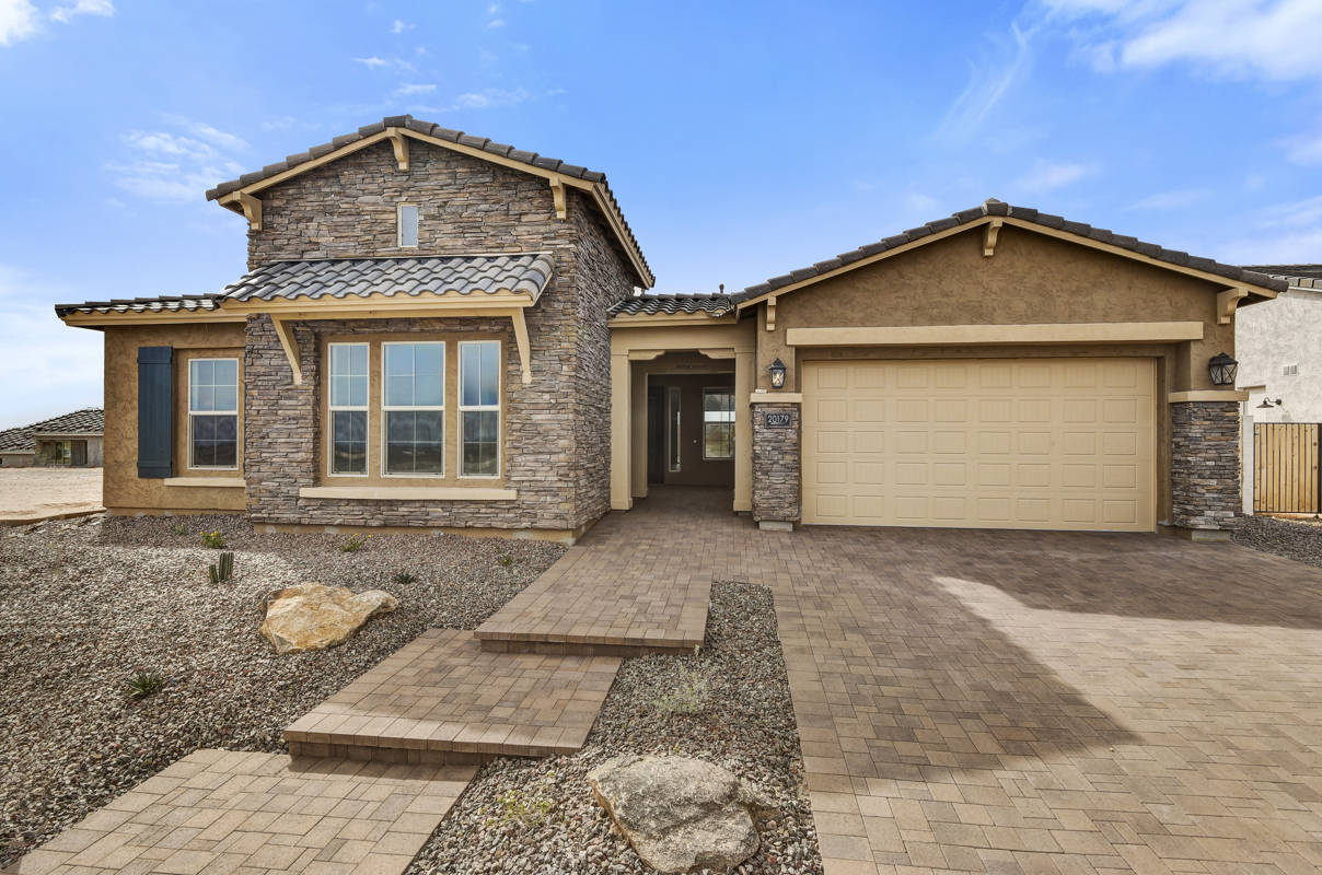 New Construction Home Exterior in Litchfield Park, AZ - The Sutherland Model by David Weekley Homes with Elegant Design and Spacious Lot