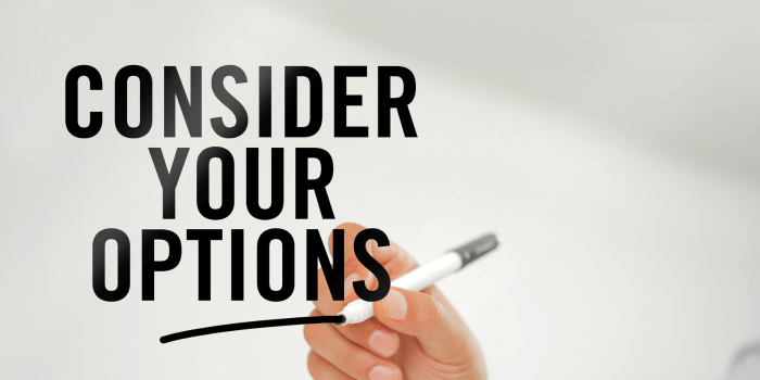 Image depicting a hand holding a marker with the text 'Consider Your Options,' symbolizing the importance of evaluating various financing options when purchasing a home or making investment decisions.