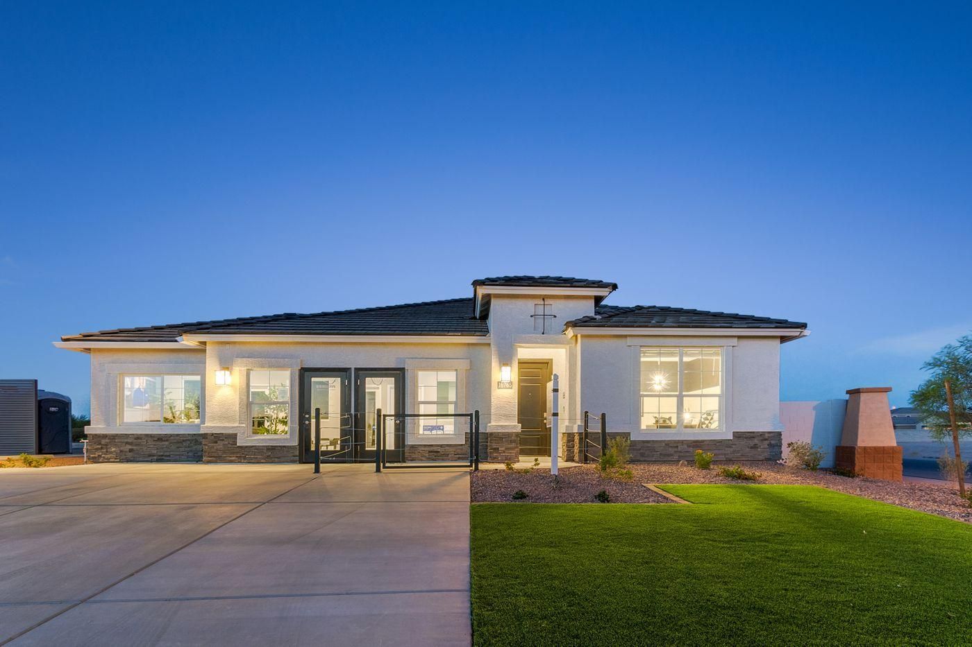 Modern new construction home with sleek architectural design, bright lighting, and a well-manicured lawn, showcasing how new builds are leading the real estate market in Arizona with attractive features, energy efficiency, and competitive builder incentives.