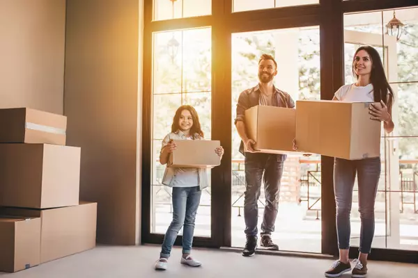 family-moving-boxes-standing