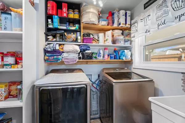 Pantry and laundry room at 408 Avenue A, Belle Chasse, LA, featuring ample storage and gas appliances.