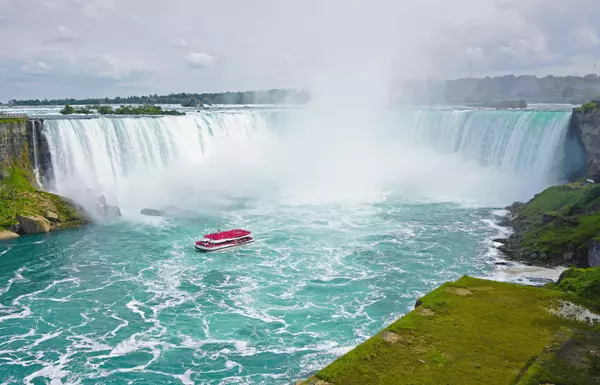 Aerial view of the iconic Horseshoe Falls in Niagara Falls, Ontario, Canada, highlighting the natural beauty of the Niagara Region. Moving to Niagara Falls? Contact Sherwin Mamaradlo at 289-501-4710—a genuine and trusted Realtor® in the Niagara Region, offering expert real estate services.