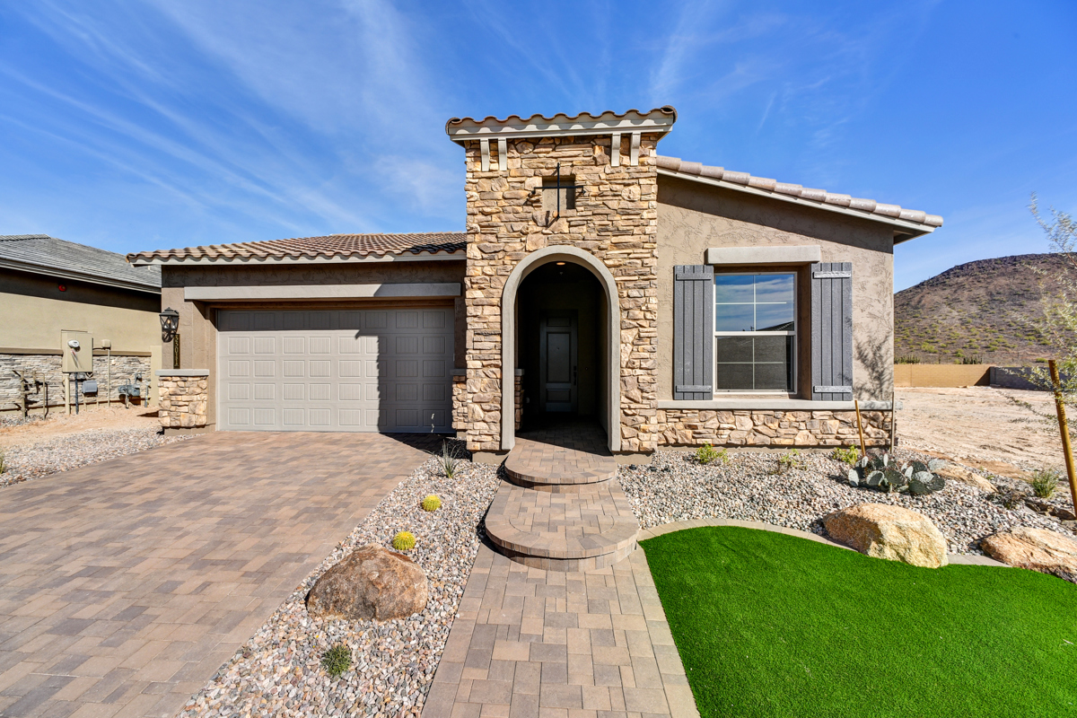 Modern new construction home in Peoria, Arizona, showcasing a stunning design with energy-efficient windows, clean lines, and a spacious exterior perfect for family living. Located in the desirable Northpointe Ascent community, this property combines luxury and practicality with scenic surroundings and contemporary architecture.