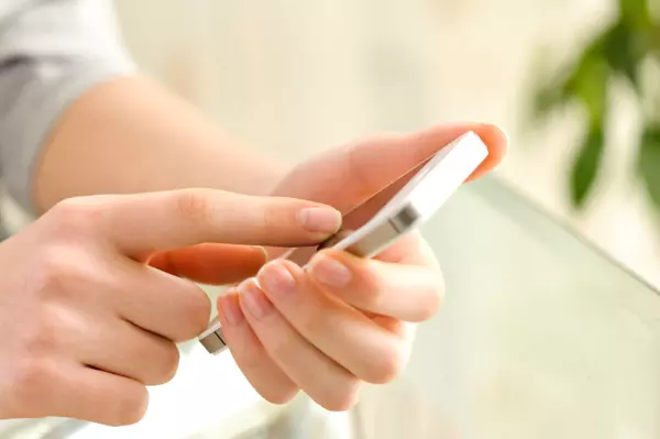 Female using her mobile phone