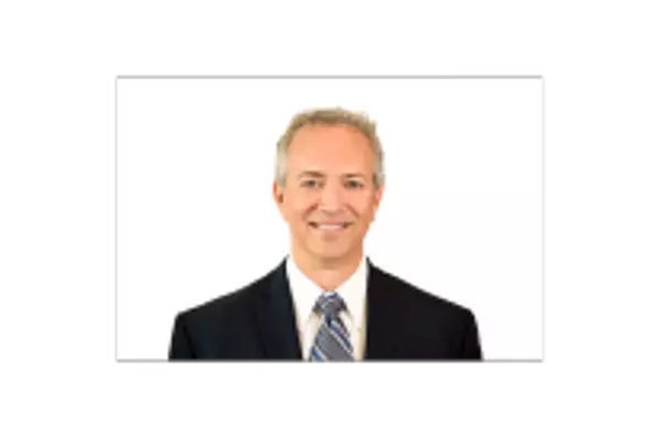 Jeff Galindo, a top real estate agent in Las Vegas, NV, in a suit and tie, representing NDR Real Estate.