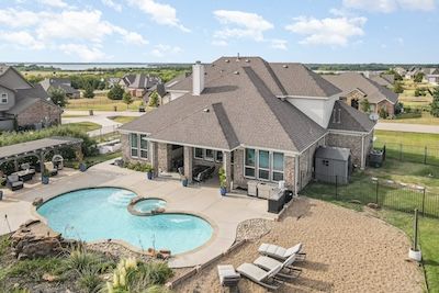 Custom home on an acre lot with a pool in Nevada, TX