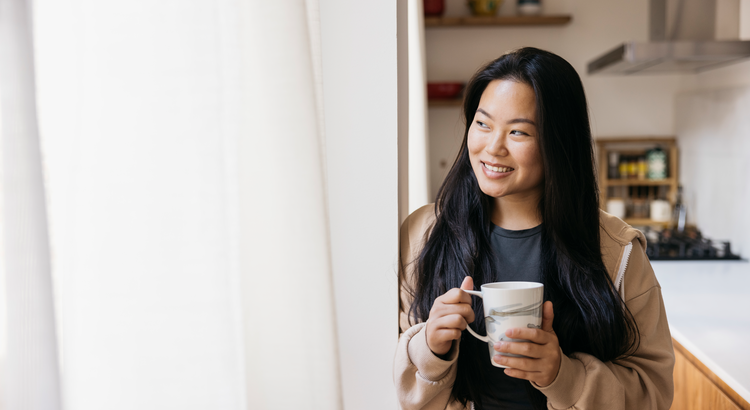 home seller in kitchen with cup