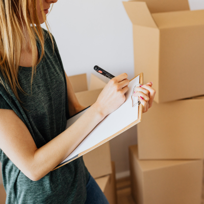 Taking notes on a final walk-through in real estate