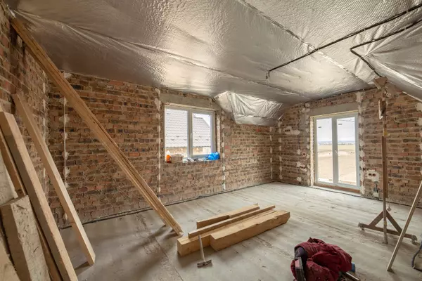 interior-unfinished-brick-house-with-concrete-floor-bare-walls-construction