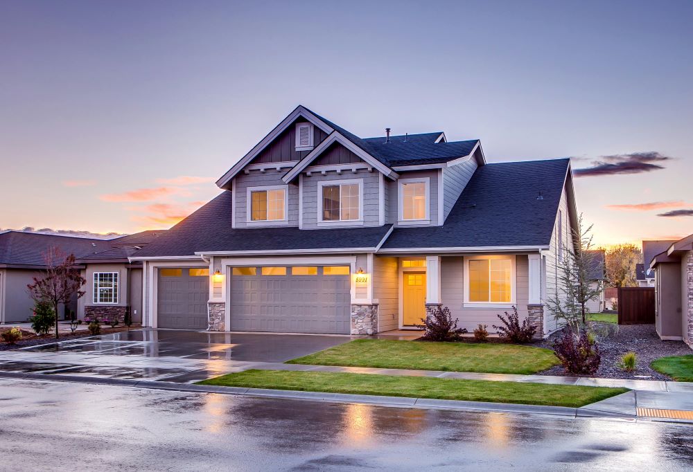 A house with a blue roof at sunset