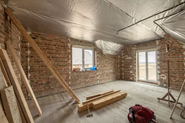 interior-unfinished-brick-house-with-concrete-floor-bare-walls-construction