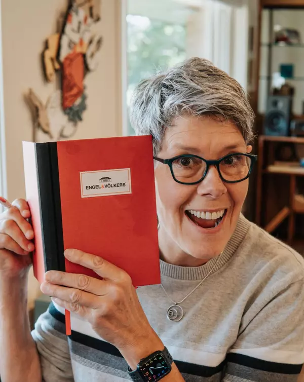 Sue Excited with EV Red Book