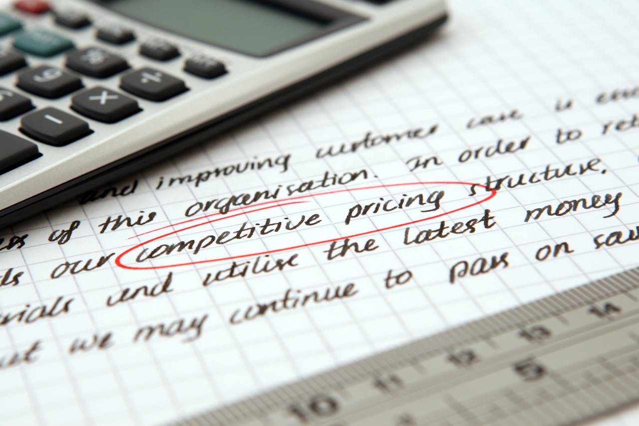 A calculator on top of a note