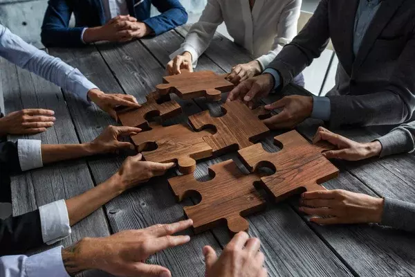 depositphotos_393212636-stock-photo-business-people-team-sitting-meeting