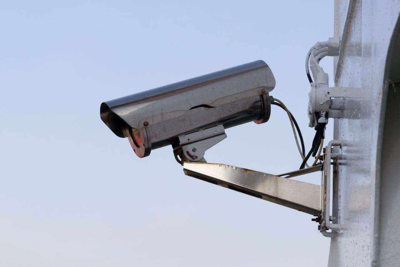 A silver security camera.