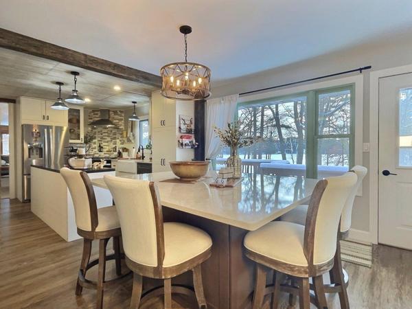 Show dining, kitchen, and the view helps buyers imagine themselves here - Eliason Realty
