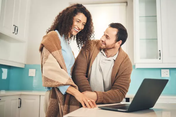 happy-couple-laptop-and-smile-for-search-interne-2023-11-27-05-37-02-utc