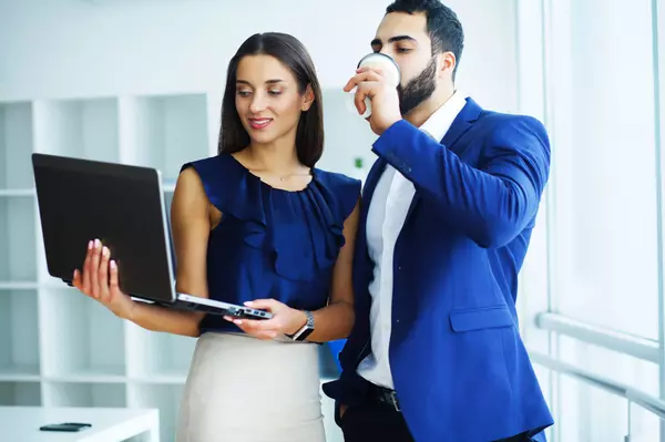 businessman-with-female-colleague-or-client-in-off-2023-11-27-04-52-42-utc