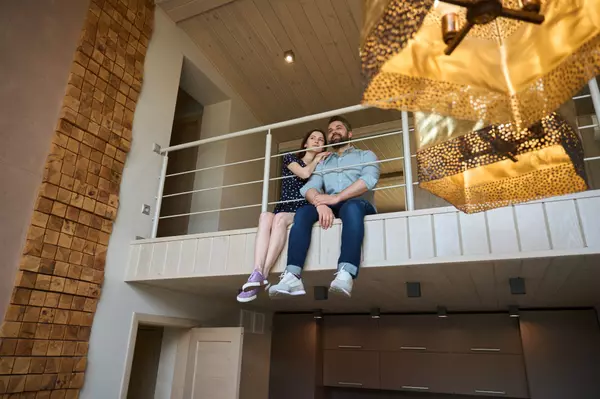 middle-aged-couple-sits-on-the-landing-on-the-seco-2023-11-27-04-50-29-utc