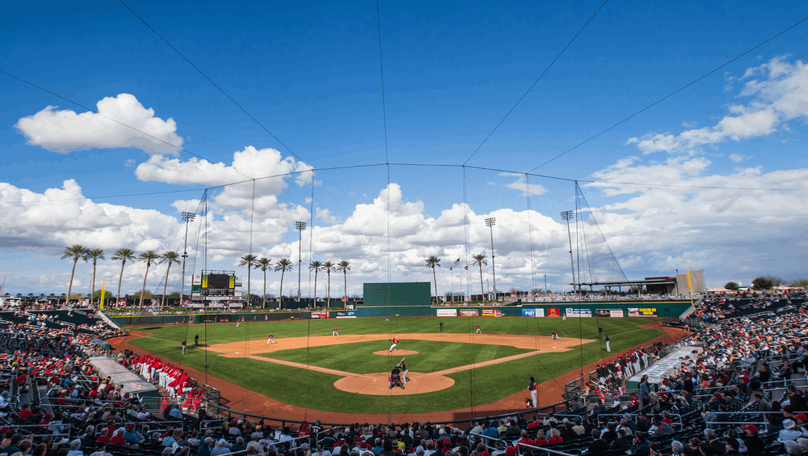 View of Goodyear Ballpark during a spring training game, showcasing the beautiful Arizona weather, palm trees, and vibrant crowd. Goodyear, AZ, is the ultimate destination for baseball fans, offering world-class spring training facilities, sunny skies, and exciting games, making it a must-visit for sports enthusiasts.