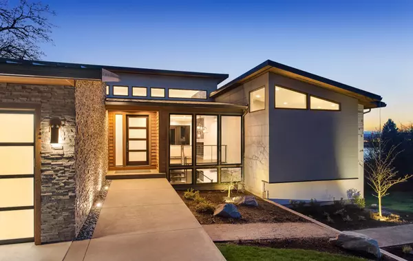 Beautiful modern style luxury home exterior at sunset with glowing interior lights. (6)