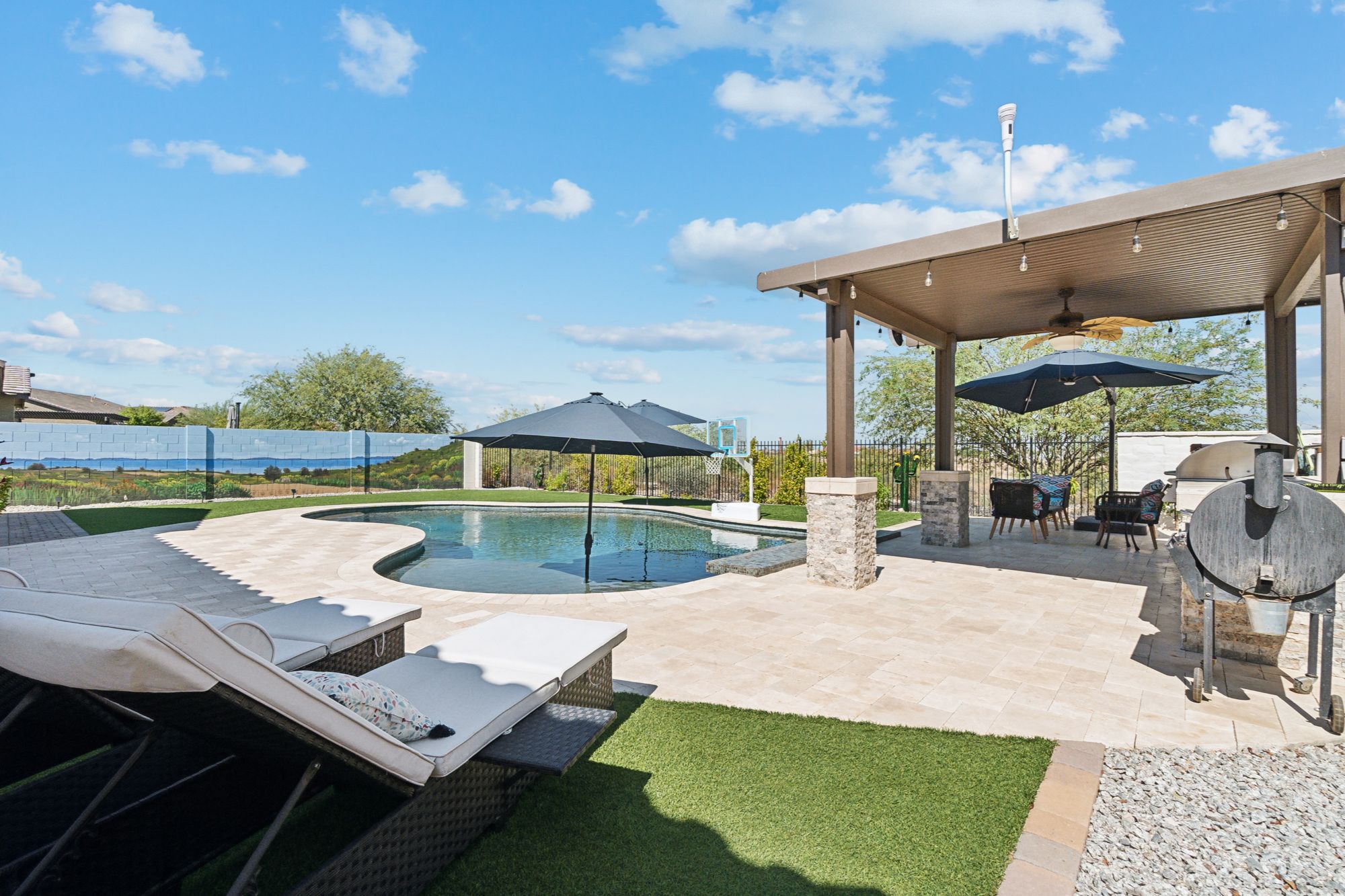 Unobstructed mountain and desert landscape views from the private backyard of a luxury Verrado home in Buckeye, AZ