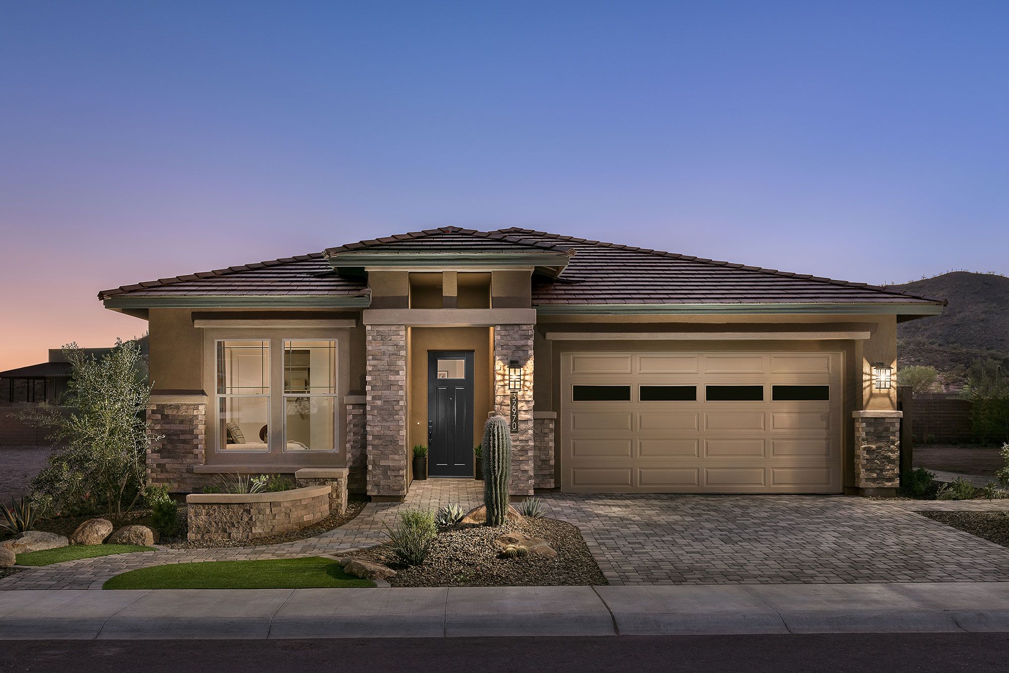 Innovative model home in Eastmark, Mesa, AZ by David Weekley Homes, highlighting modern design and community-friendly layout.