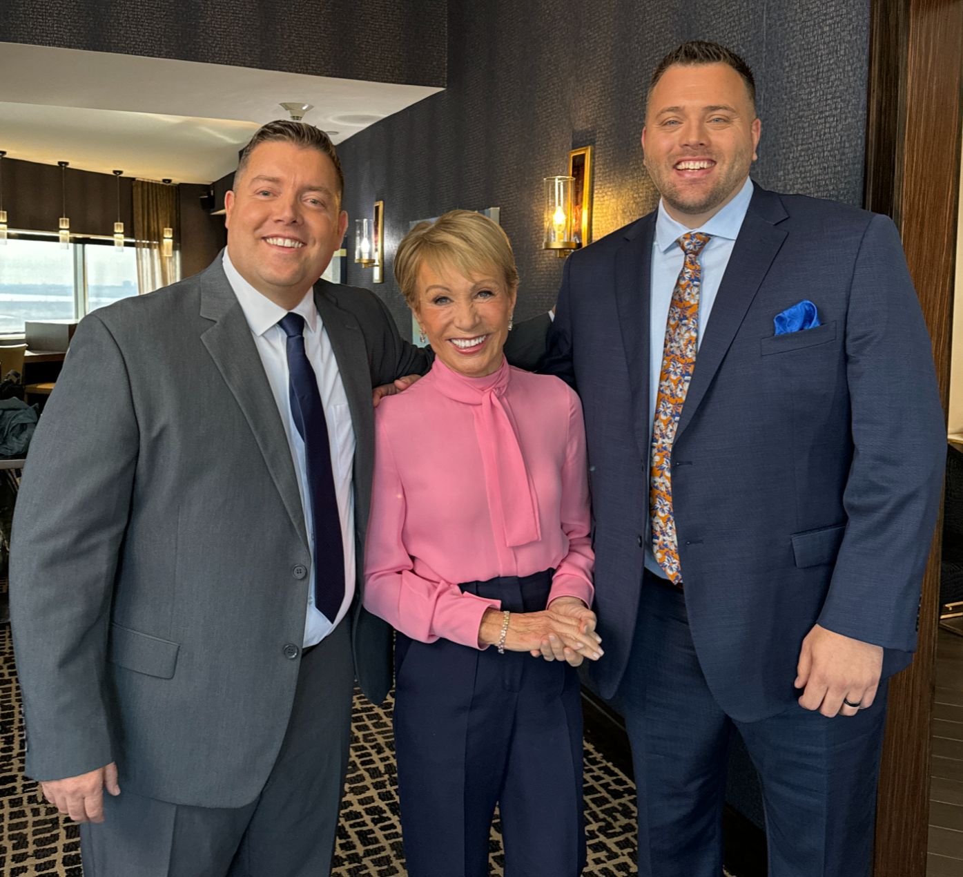 Dustin Cagle, Garrett Pancheri, and Barbara Corcoran together, with Barbara Corcoran endorsing Living in Idaho as the only real estate team she trusts in Idaho