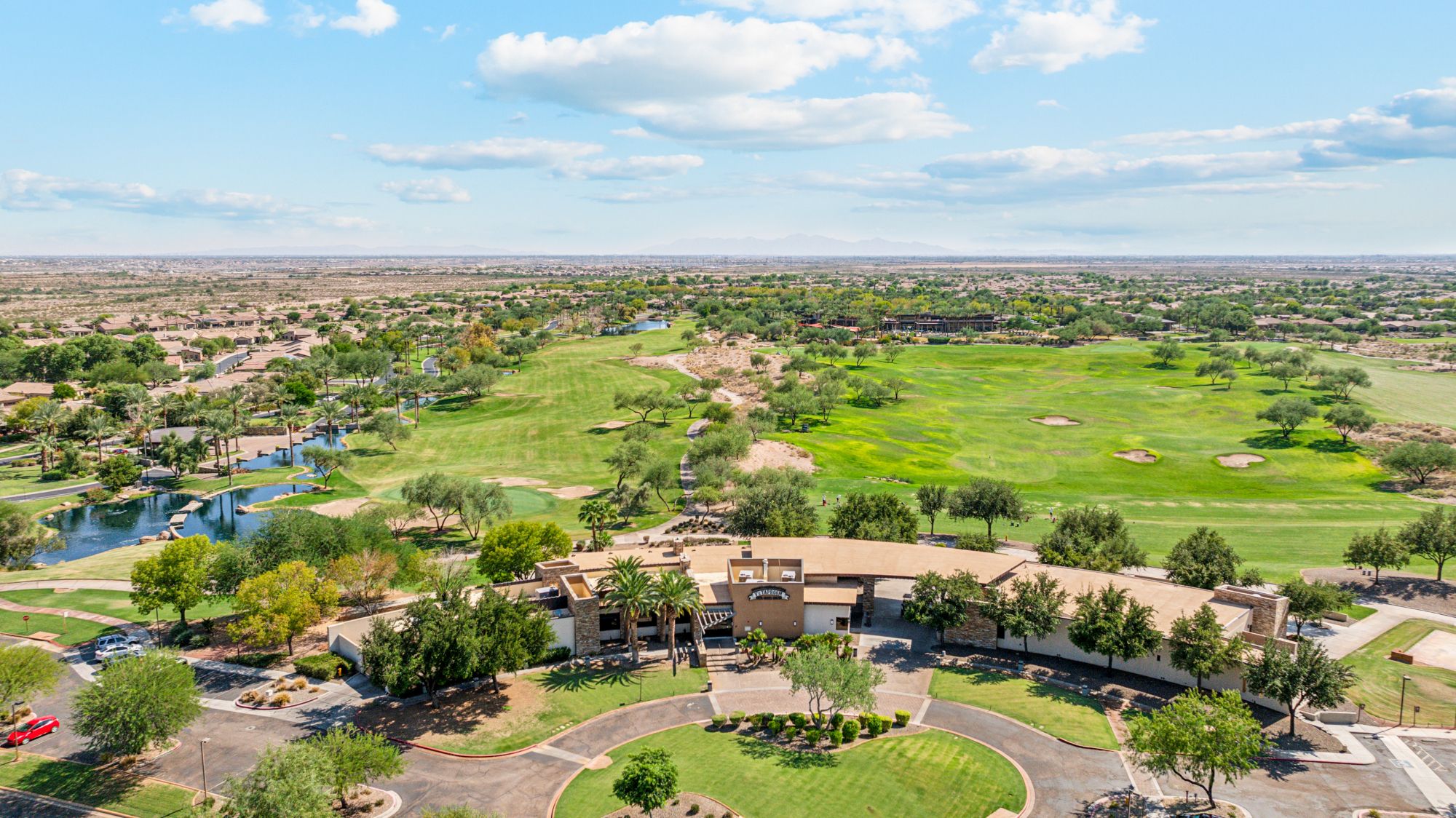 Scenic view of the golf course near a beautiful home in the Vistancia community, Peoria, AZ, showcasing well-maintained greens and surrounding desert landscape.