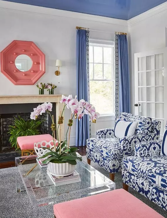 pink-octagon-mirror-over-limestone-fireplace-mantel