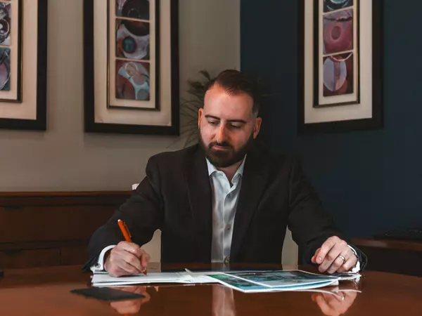 ryan zimmer real estate agent working on contract