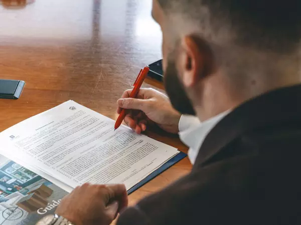 filling out contract for selling your home