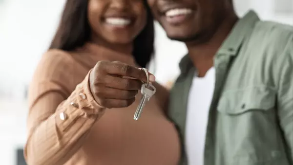 unrecognizable-black-couple-showing-key-from-apart-2023-11-27-04-56-03-utc