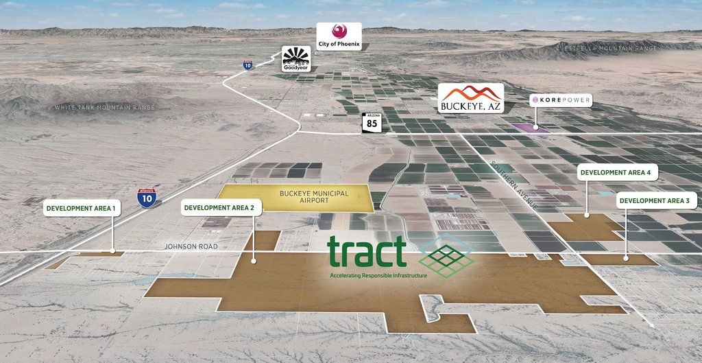 Aerial view of a vast 2,100-acre tract of land in Buckeye, Arizona, recently acquired for a $20 billion data center project. The site is set to become one of the largest data centers in the United States, showcasing expansive open terrain under clear skies, with the city of Buckeye visible in the distance.